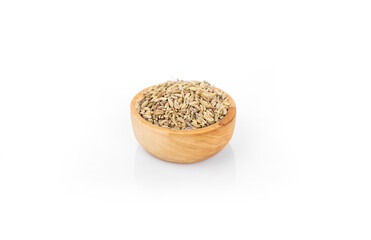 fennel seed. dry fennel seed in wooden bowl on white background. fennel