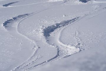 Fresh ski tracks in the snow at Mount Rigi. Photo taken April 14th, 2021, Rigi Kulm, Switzerland.