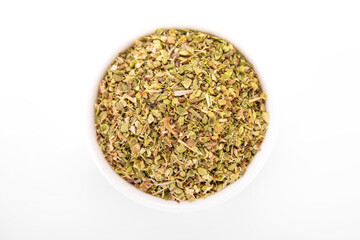 dry oregano. dry oregano spice in white bowl on white background. oregano, dry oregano