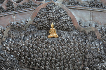 Detail of aluminium and silver bas-relief with stories of Buddhism, dharma puzzles, and the history of the Wat Sri Suphan, Silver temple in Chiang Mai, Thailand