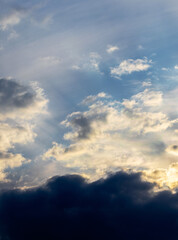 Light and dark clouds in the dramatic sky during sunrise