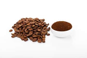ground coffee. ground coffee in white bowl on white background with coffee beans.