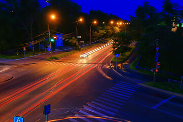 Fototapeta na wymiar night street transport traces of light, traffic road urban