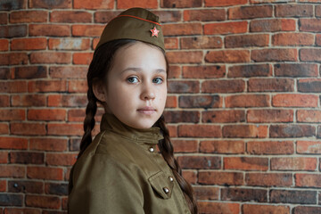 Little girl in military uniform at the May 9 celebration in Russia, Victory Day.