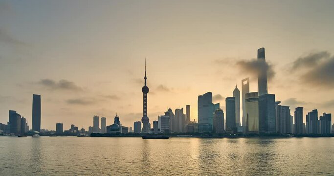 Panoramic of Shanghai Skyline Silhouette at Dawn. Lujiazui Financial District and Huangpu River, China. Panning footage (Time-lapse)