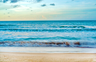Fototapeta na wymiar Beautiful sea wave on the sand beach in Sunset time