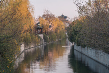Fototapeta na wymiar Sunset landscape of Suzhou ancient city wall park