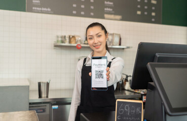Close up of woman hand holding a smartphone QR code screen scanning in cafe restaurant, quick response online convenience payment process. Internet banking. Online wallet. Cashless. Business service.