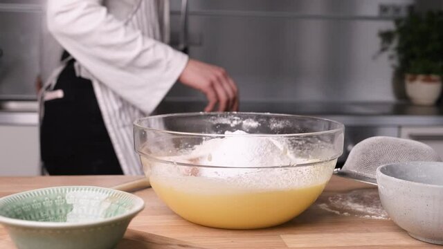 Baker Preparing Ingredient Mix for Carrot Cake Batter - Slider Left