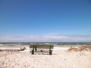 Bench on beach in Stilo, Baltic Sea coast, Poland.
