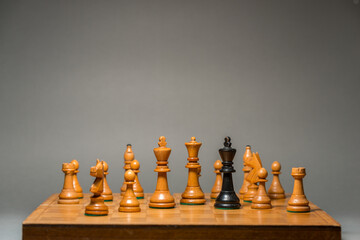 Black king is alone on the chess board.