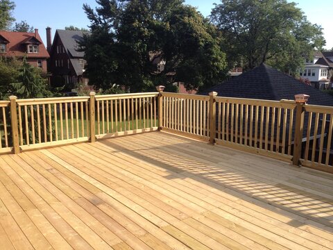 Construction of large wood deck on flat roof garage