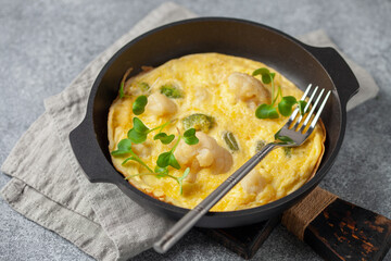 Broccoli cauliflower egg omelette in a plate on the table. Diet nutrition