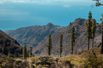 Rocks photographed from above. The landscape in the mountains leads to the ocean overlooking the neigh boring island and the volcano. A trip inland to the island of Gomera, Canary Islands.