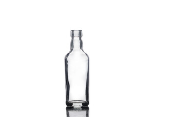 Empty small glass bottle isolated on white background.