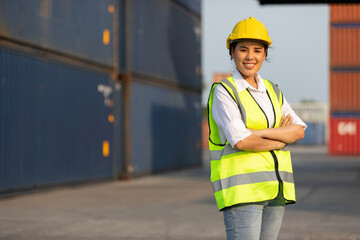 woman factory worker or engineer crossed arms pose with containers warehouse storage