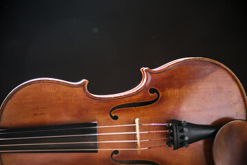 Close up of a violin isolated on a black background