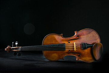 Fototapeta premium Close up of a violin isolated on a black background