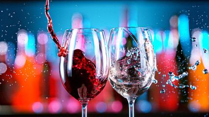 Wine glasses tapping in a bar. Party and nightlife concept