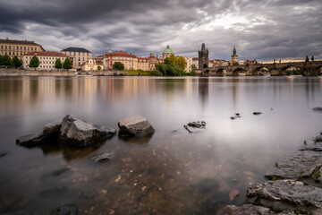 Fototapeta premium View of the river with stones in Prague