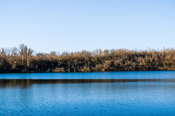 Water reflection in sand quarry lake
