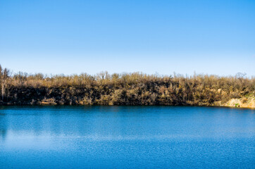 sand quarry with lake in spring