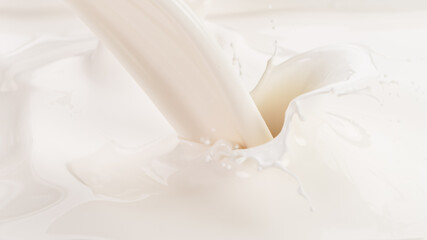 Obraz na płótnie Canvas Splashing milk on white background