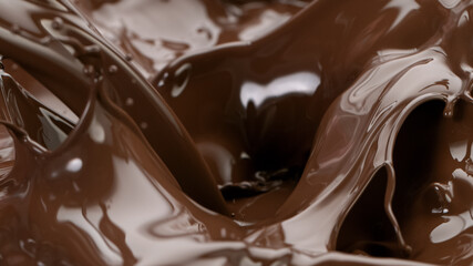Splashing hot chocolate texture, close-up.