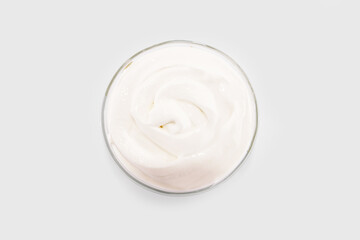 sour cream in a glass plate, mayonnaise, yogurt isolated on a white background.
