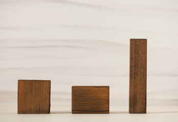 Natural wooden podiums for organic eco frinedly cosmetic products against light background. Copy space