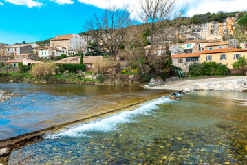 Fototapeta na wymiar The river Cesse as it flows through the picturesque village of la Caunette