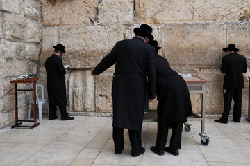 Jerusalem: Men praying at the western wall or wailing wall in the old city