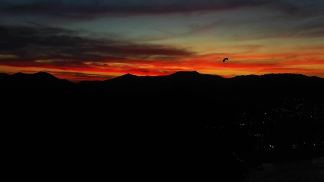Aerial view of people paragliding at careca hill, Balne&aacute;rio Cambori&uacute;, Brazil.