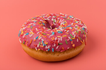 Fresh made Donuts isolated on pink background. Doughnuts are traditional sweet pastries. Copy space for text.