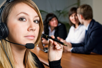 Beautiful business woman with headset