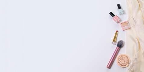 Beauty background with facial cosmetic, make-up products. Free space for text, copy space. Modern layout, top view, flat lay. Make up, skin care, beauty concept.