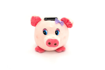 Pink piggy bank isolated on a white background.