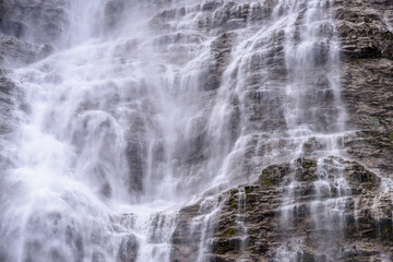 Naklejka na ściany i meble Mountain waterfall near Murren, Switzerland
