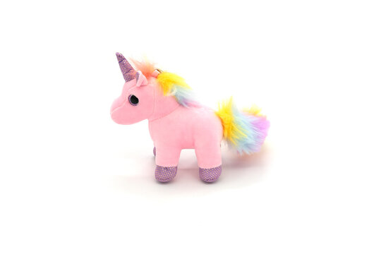 Pink unicorn plush toy. Isolated on white background