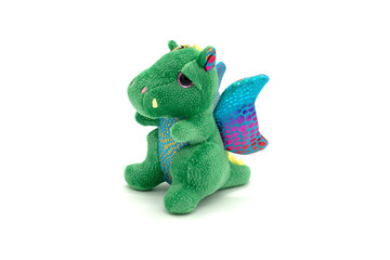 Soft toy dragon isolated on white background.