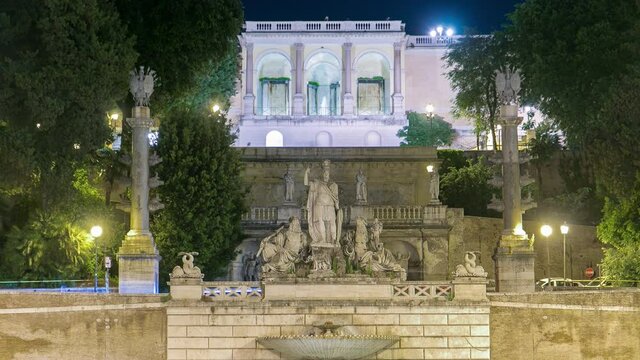 illuminated fountain of Dea Roma night timelapse in Piazza del Popolo with Pincio terrace in the background