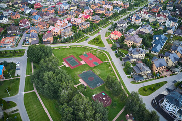 Aerial view of sport playgrounds near the real estate area