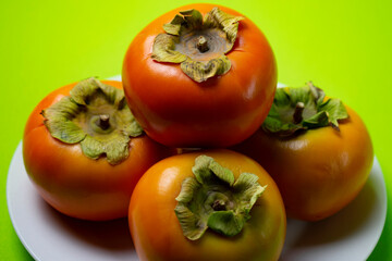 persimmon fruit on a plate