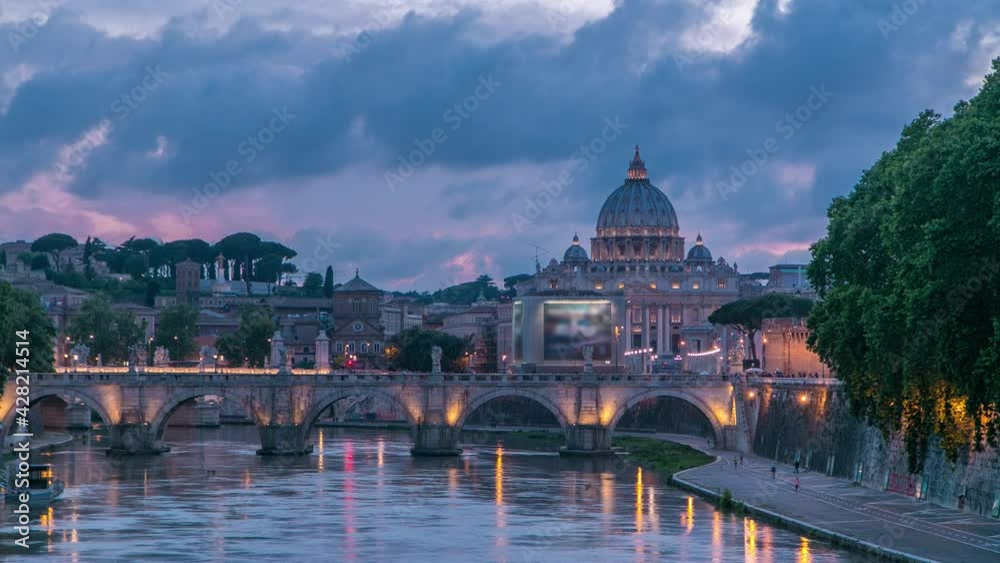 Wall mural St. Peter's Basilica, Saint Angelo Bridge and Tiber River after the sunset day to night transition timelapse. View from bridge with beautiful cloudy sky. Rome, Italy