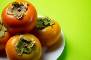 persimmon fruit on a plate