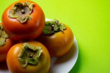 persimmon fruit on a plate