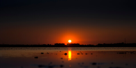 Sunset, sunrise on the calm sea