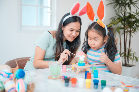 young family people making easter egg in holiday at home, decoration background, spring colours rabbit tradition, children happy celebration art creative design with easter day