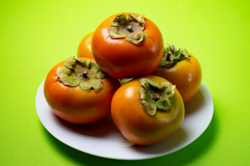 persimmon fruit on a plate