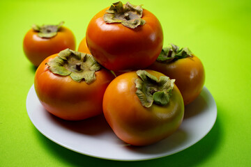 persimmon fruit on a plate